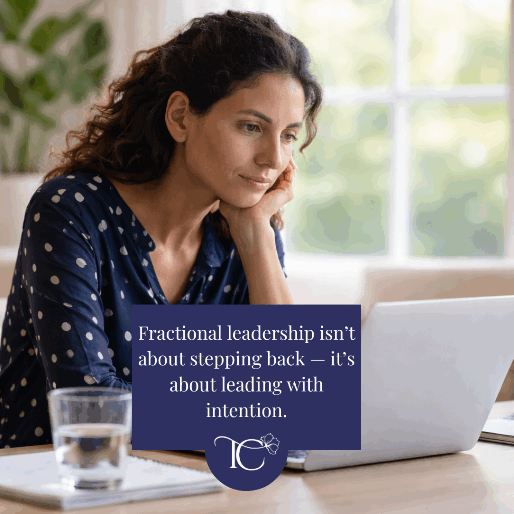 Senior woman in tech working thoughtfully on a laptop, representing fractional leadership as a modern executive career path