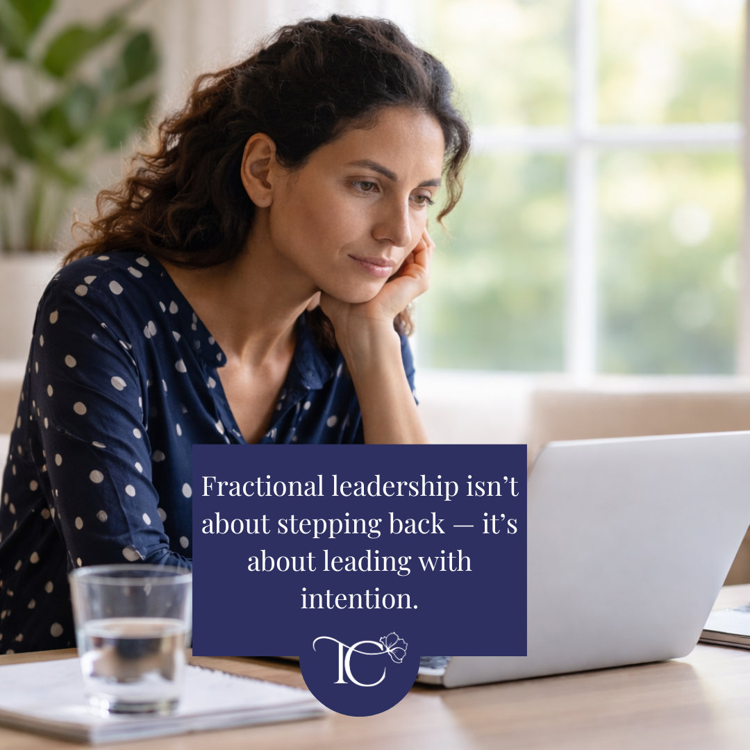 Senior woman in tech working thoughtfully on a laptop, representing fractional leadership as a modern executive career path